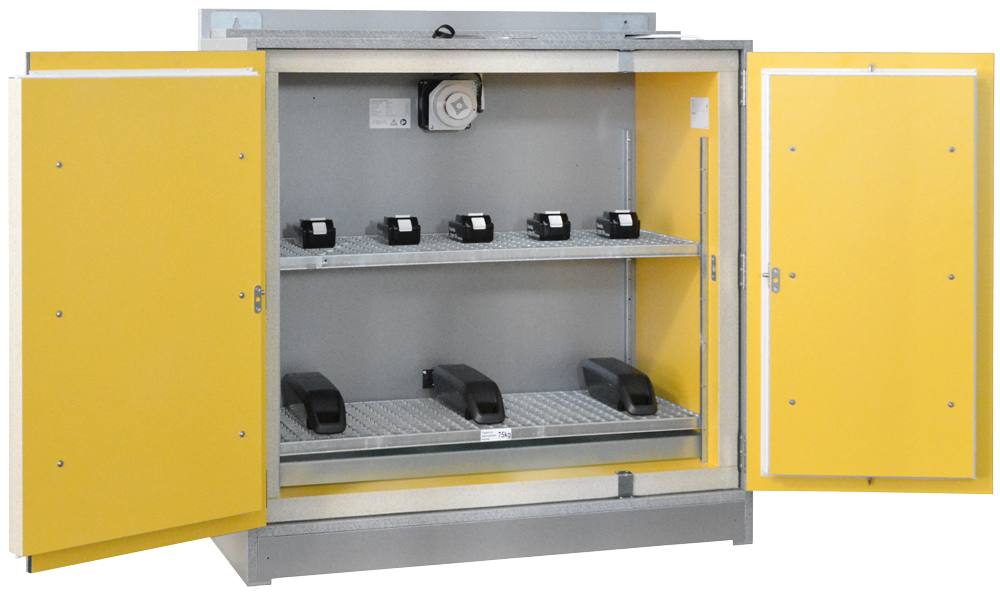 An open grey battery safety storage cabinet with yellow doors. Inside are two wire mesh shelves: five small black Li-ion batteries on the top shelf and three larger ones below. A ventilation fan is visible at the top.