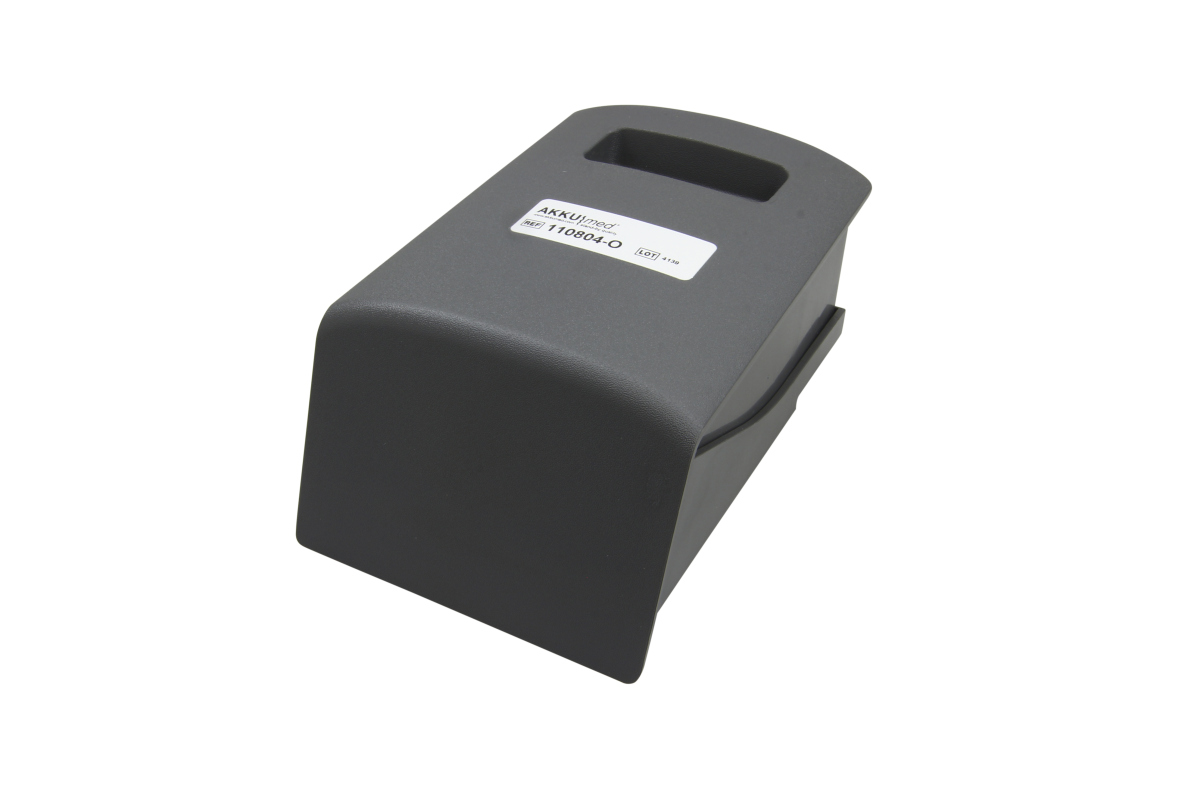 Batería de polímero de litio gris oscuro, alargada, con esquinas redondeadas y hueco de agarre superior. Etiqueta blanca «AKKUImed» y ref. «110804-O». Compatible con sistemas de reanimación Lucas Physio Control.
