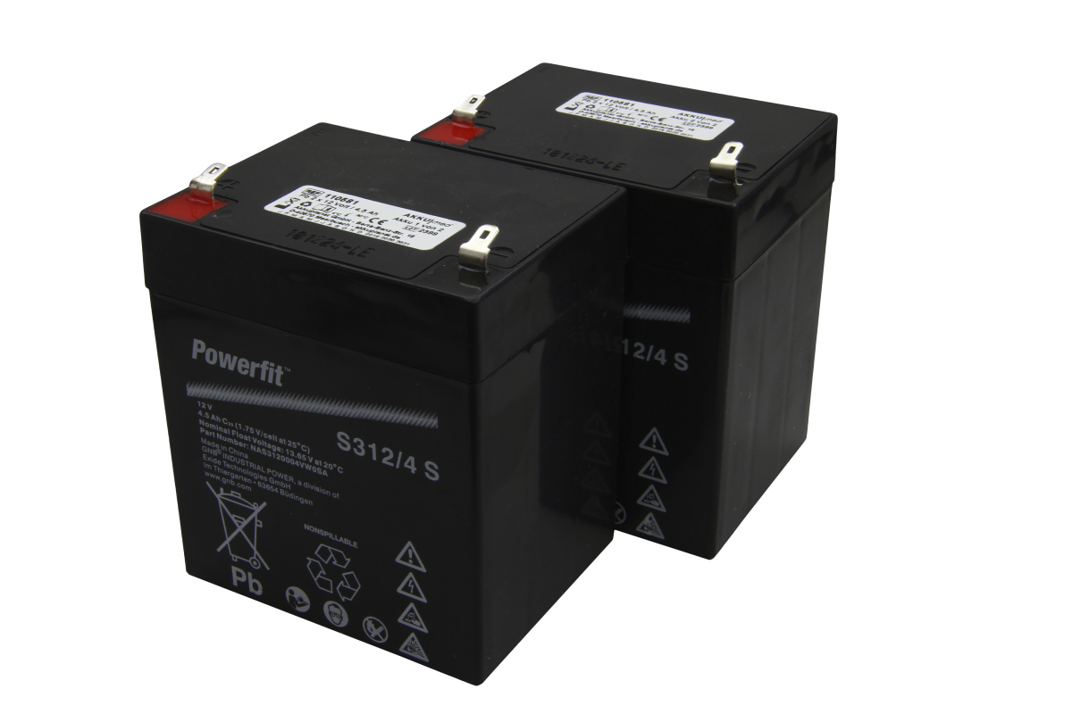 Two black, rectangular lead-acid batteries with metal terminals on top. The front bears the Powerfit brand name, 12V/4.5 Ah, as well as hazard and recycling pictograms. Suitable for Reha- and Medi-Mobilizer devices.
