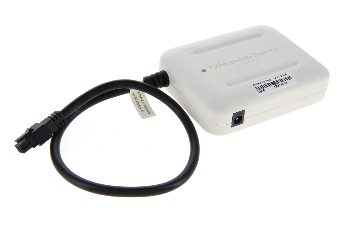 White, rectangular ‘ Laerdal ’ lithium-ion battery pack, type 204-00350. The top is marked ‘Lithium-ion Battery Laerdal’. On the left is a black cable with a plug, looped. Round charging socket marked ‘OMG’ and a label reading ‘AKKU|med REF 120145-O’.