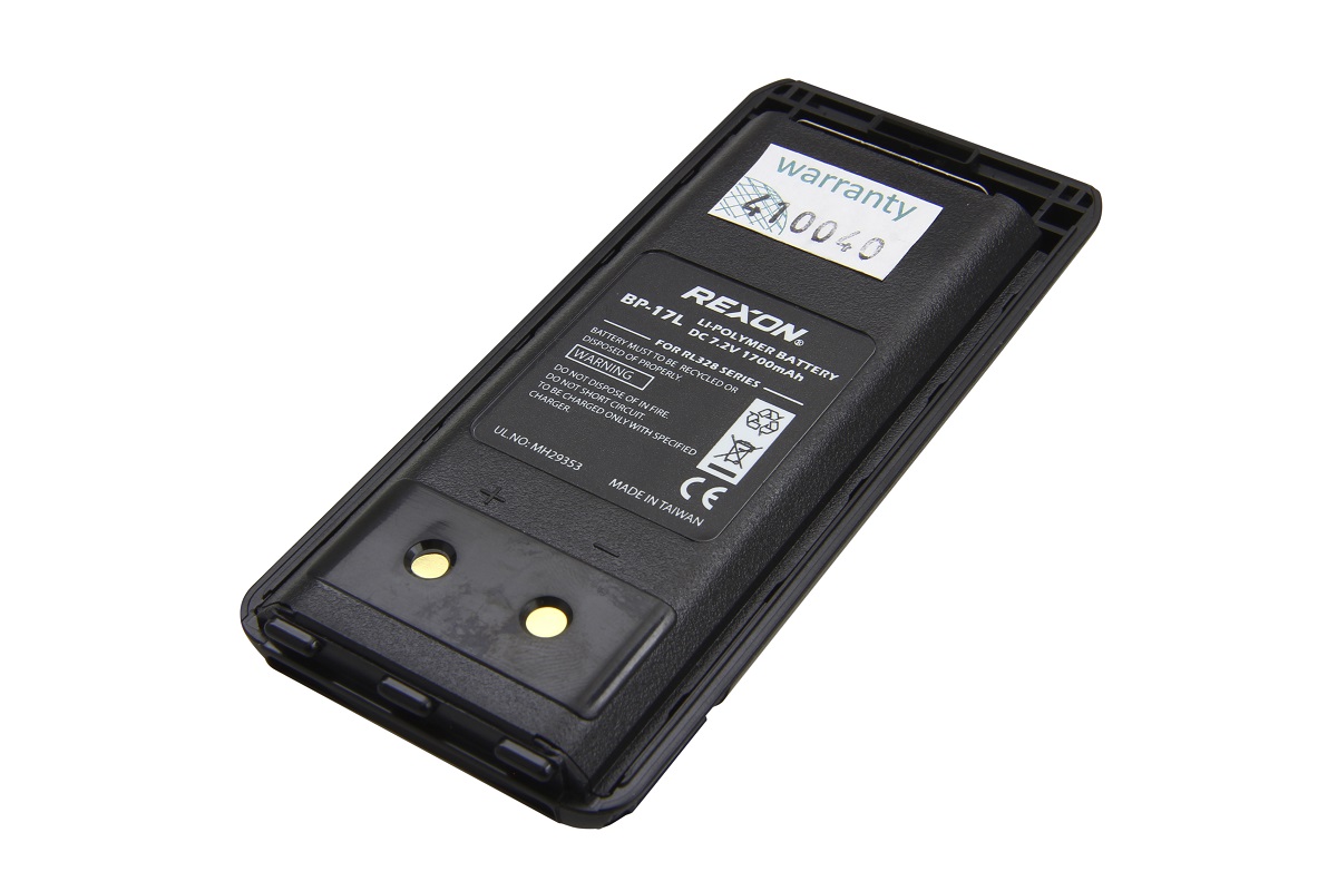 Batteria ai polimeri di litio Rexon BP-17L nera e rettangolare per Rexon RL328. Stampa: 7,2 V, 1700 mAh. Lato inferiore: due contatti dorati con indicazione più/meno. Etichetta di garanzia parzialmente visibile.