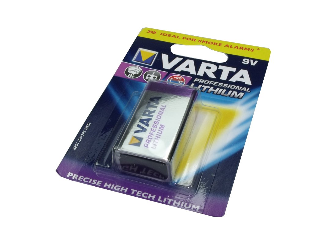 Varta Ultra Lithium 9V batteri (E-block) i förseglad blisterförpackning. Silverbatteri synligt genom transparent fönster på blå-lila kartong. Förpackningen märkt med "Professional Lithium", "9V" och anvisning för brandvarnare.