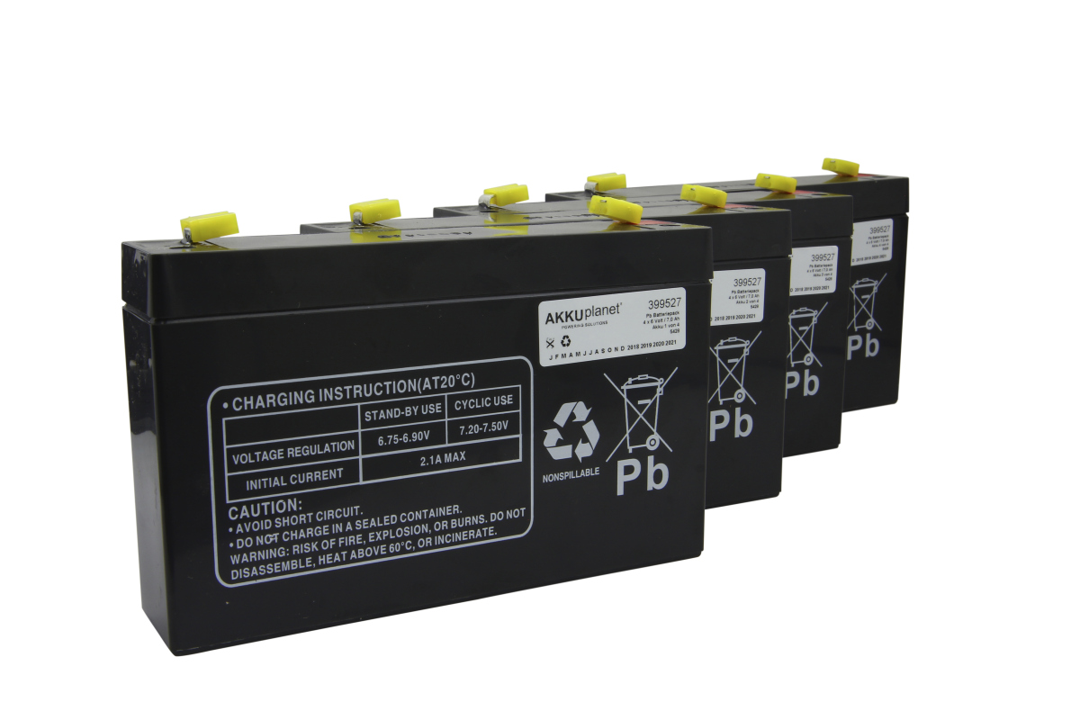 Four black rectangular replacement batteries with yellow caps are lined up. Charging, safety and disposal symbols (Pb, Recycling) appear on the front. 6V 7.0Ah lead-acid batteries, suitable for APC RBC34.