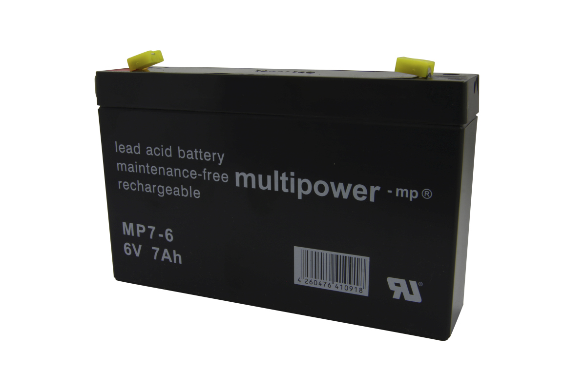 Black, rectangular Multipower MP7-6 lead-acid battery. Labelled with ‘lead acid battery’, ‘maintenance-free’, ‘rechargeable’, ‘Multipower ’, ‘MP7-6’ and ‘6V 7Ah’. Two yellow protective caps on top. Barcode.