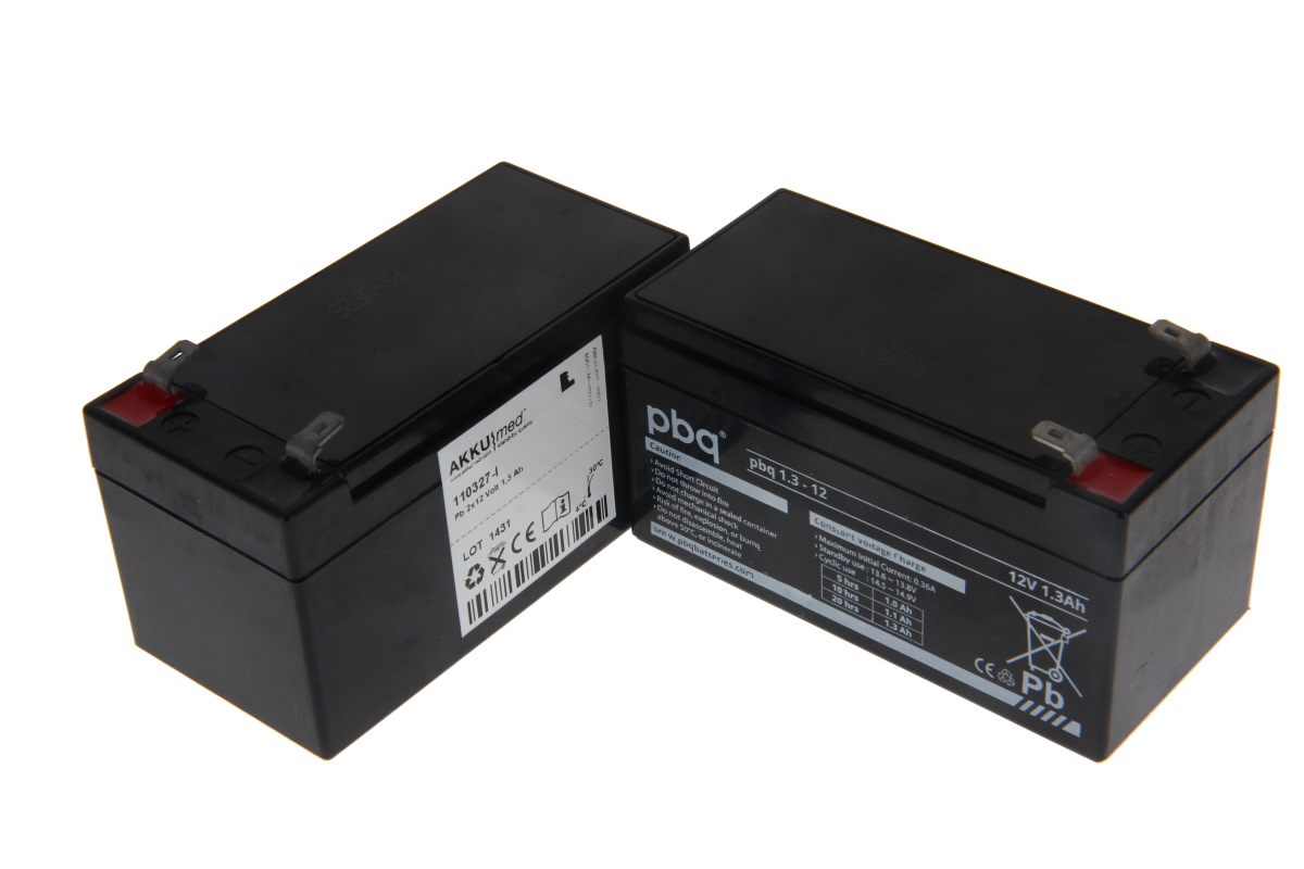 Two black, rectangular lead-acid battery inserts with red and black terminals at the top, side by side on a white background. Labels: AKKUmed, pbq, 12V 1.3Ah. Suitable for Stiegelmeyer Epostyle/Seta intensive care beds.