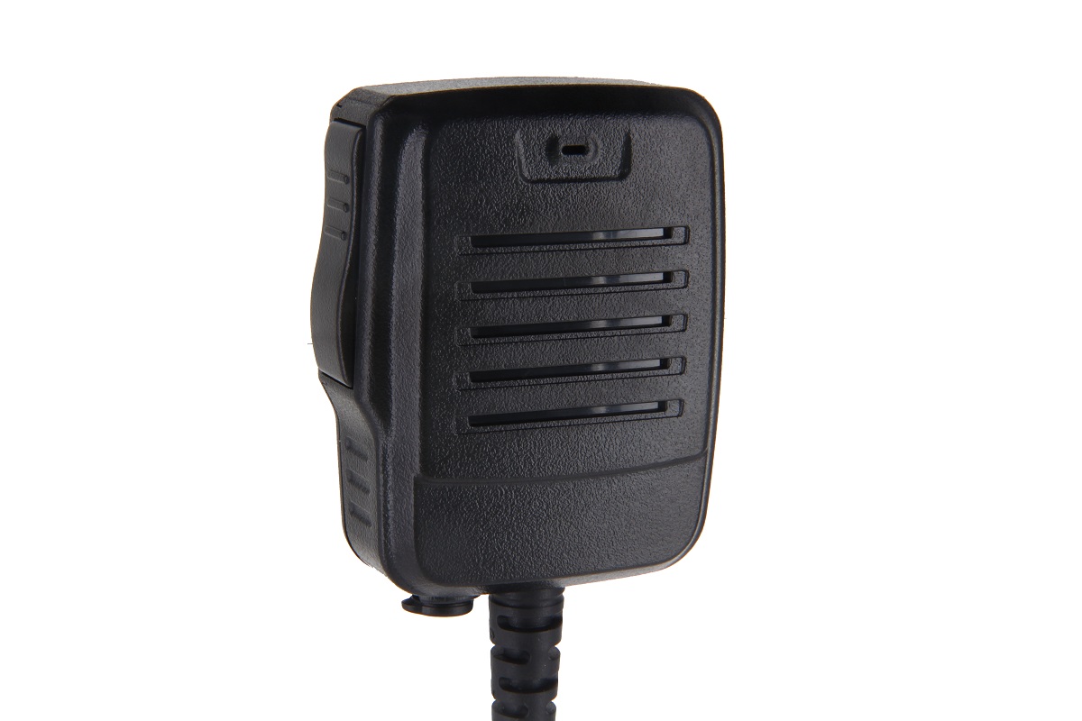 Microfono con altoparlante nero e robusto, superficie strutturata. Frontale con fessure orizzontali e foro microfono in alto. A sinistra grande pulsante Push-to-Talk. Cavo ondulato sotto. Compatibile con EADS/Airbus THR9/THR9i.