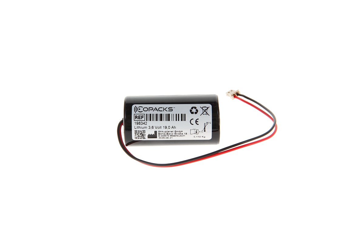 Black cylindrical CoPacks lithium battery, 3.6 V, 19.0 Ah. Two cables (red/black) with a white connector. Suitable for Visonic 710/720 sirens. White label with product information and warning symbols.
