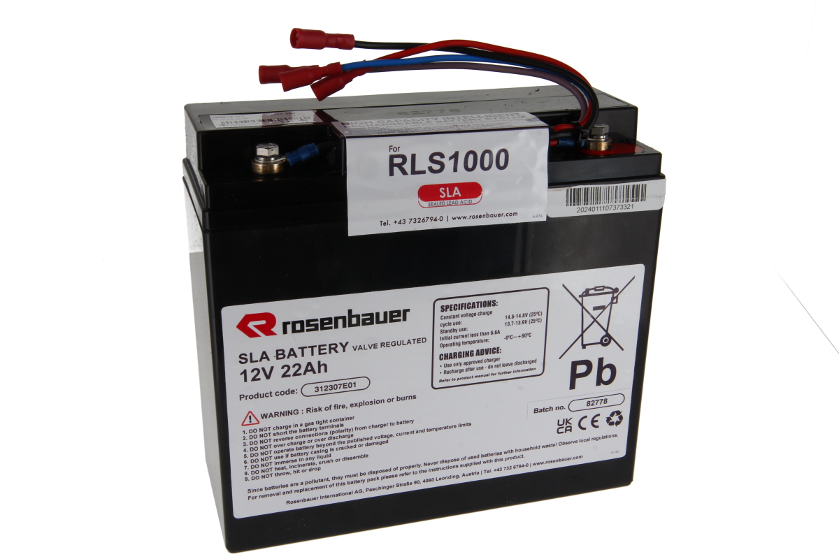 Black rectangular Rosenbauer lead-acid battery, 12V 22Ah, for RLS1000 lighting system. Top terminals with red, blue and black insulated cables and red spade terminals. Label with logo, specs and safety warnings.