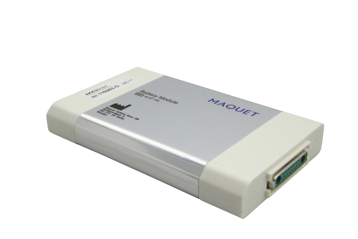 Modulo batteria color beige chiaro/argento, con la scritta "Battery Module" e "Maquet" nella parte superiore. Numero articolo 6487180 visibile. A destra, connettore D-Sub verde. Batteria NiMH per Siemens/Maquet Monitor Servo-i/Servo-s.