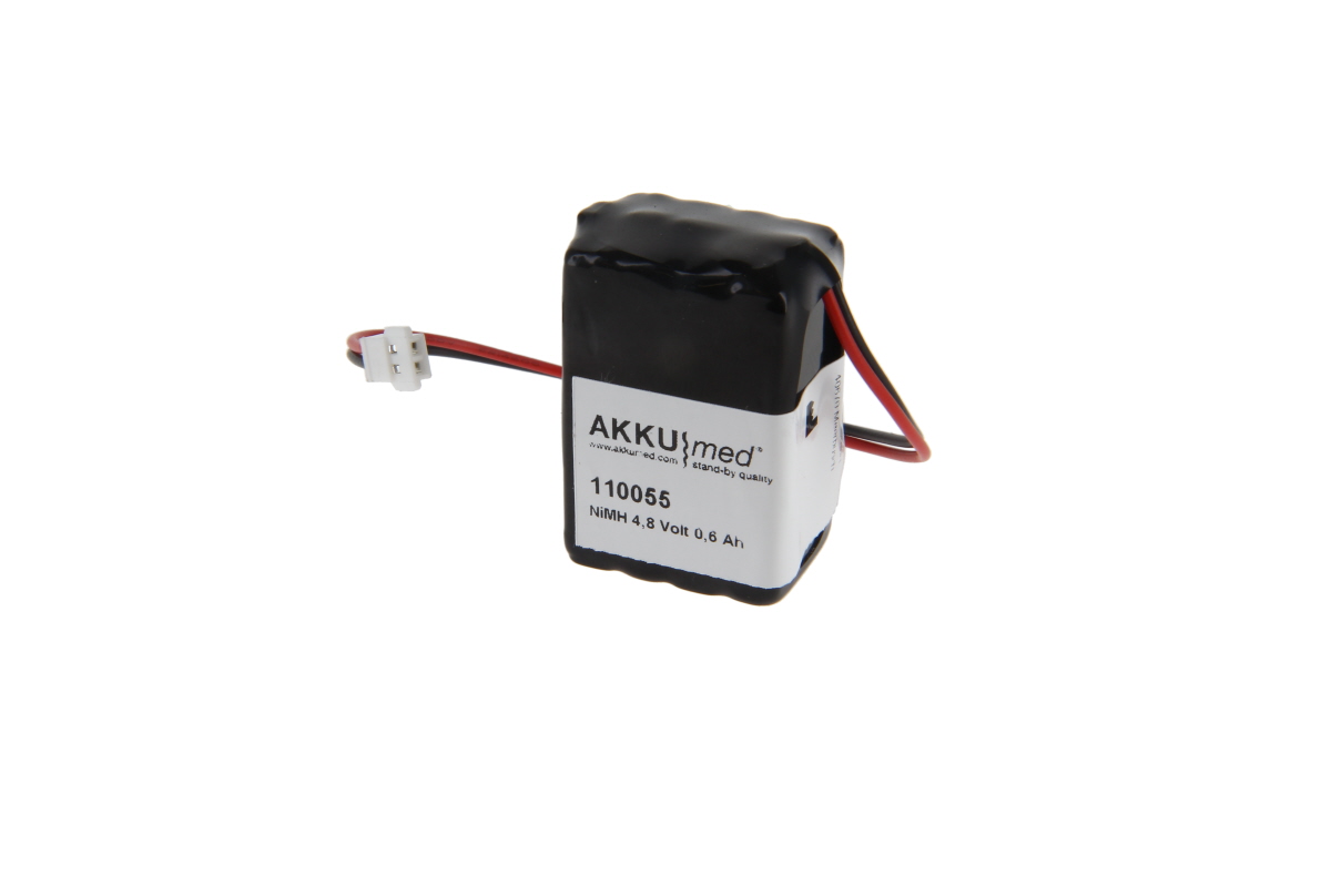 Batteria NiMH nera, rettangolare, con etichetta bianca (AKKUMED) e dati "4,8 Volt 0,6 Ah". Due cavi (rosso/nero) con piccolo connettore bianco. Ricambio per misuratore di itterizia Minolta.
