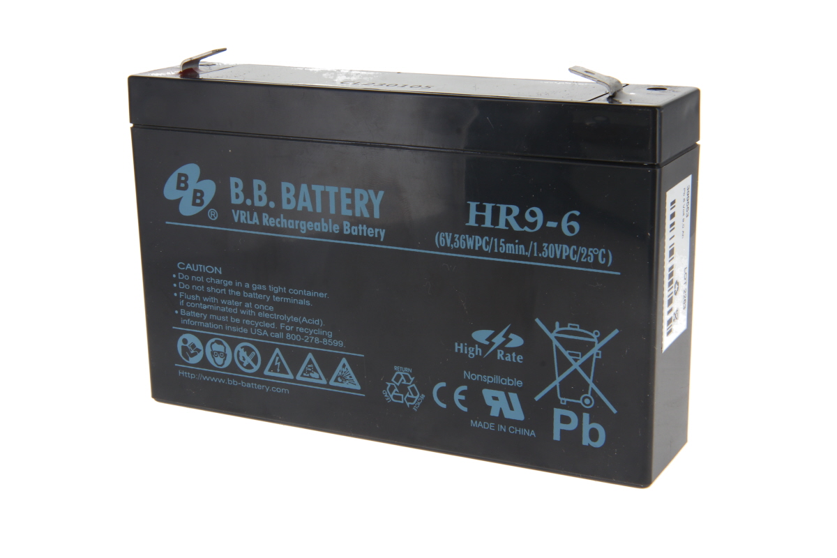 Black, rectangular lead-acid battery HR9-6 from B.B. Battery. Front panel marked ‘VRLA Rechargeable Battery’ and ‘6V’. Two flat metal terminals on top. Warning labels, recycling symbols and CE marking.