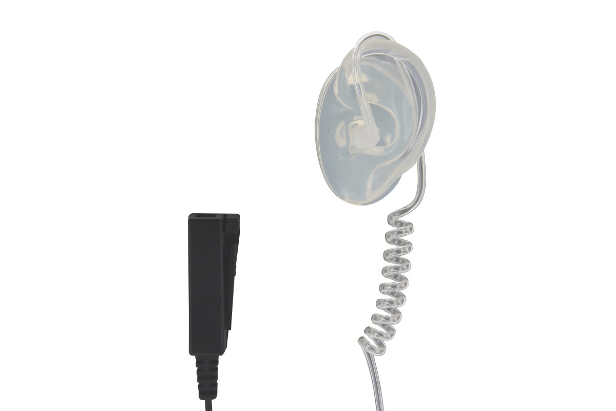 Transparent acoustic tube headset designed for discreet wear. Features soft earpieces and a coiled, transparent tube. On the left is a black, rectangular control unit with a sturdy clip for push-to-talk and a microphone.