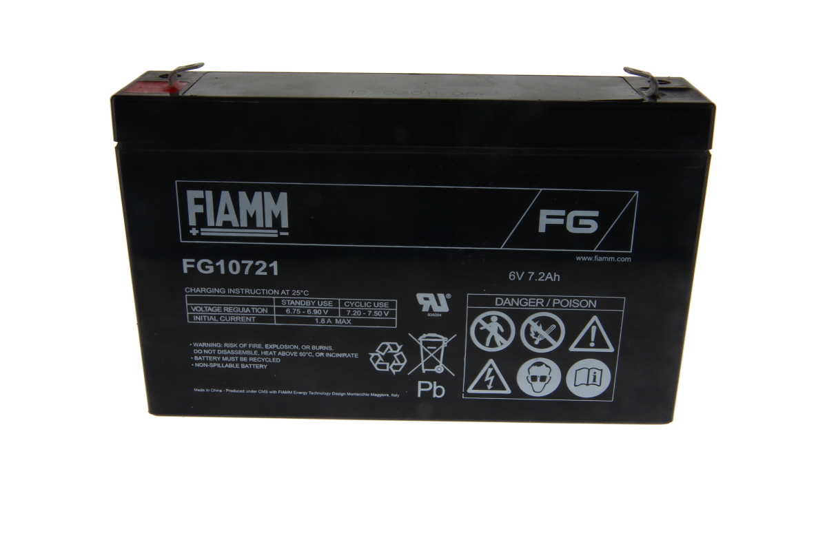 Black ‘ FIAMM ’ lead-acid battery, type FG10721, with visible terminals on top. Front features the ‘ FIAMM ’ logo, model number, 6 volts 7.2 Ah, charging instructions, safety warnings and recycling symbols.